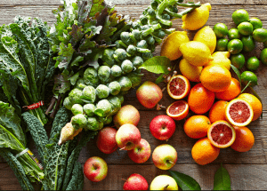 a group of fruits and vegetables on a wood surface Healthy Weight Loss Diets Kingston upon Thames